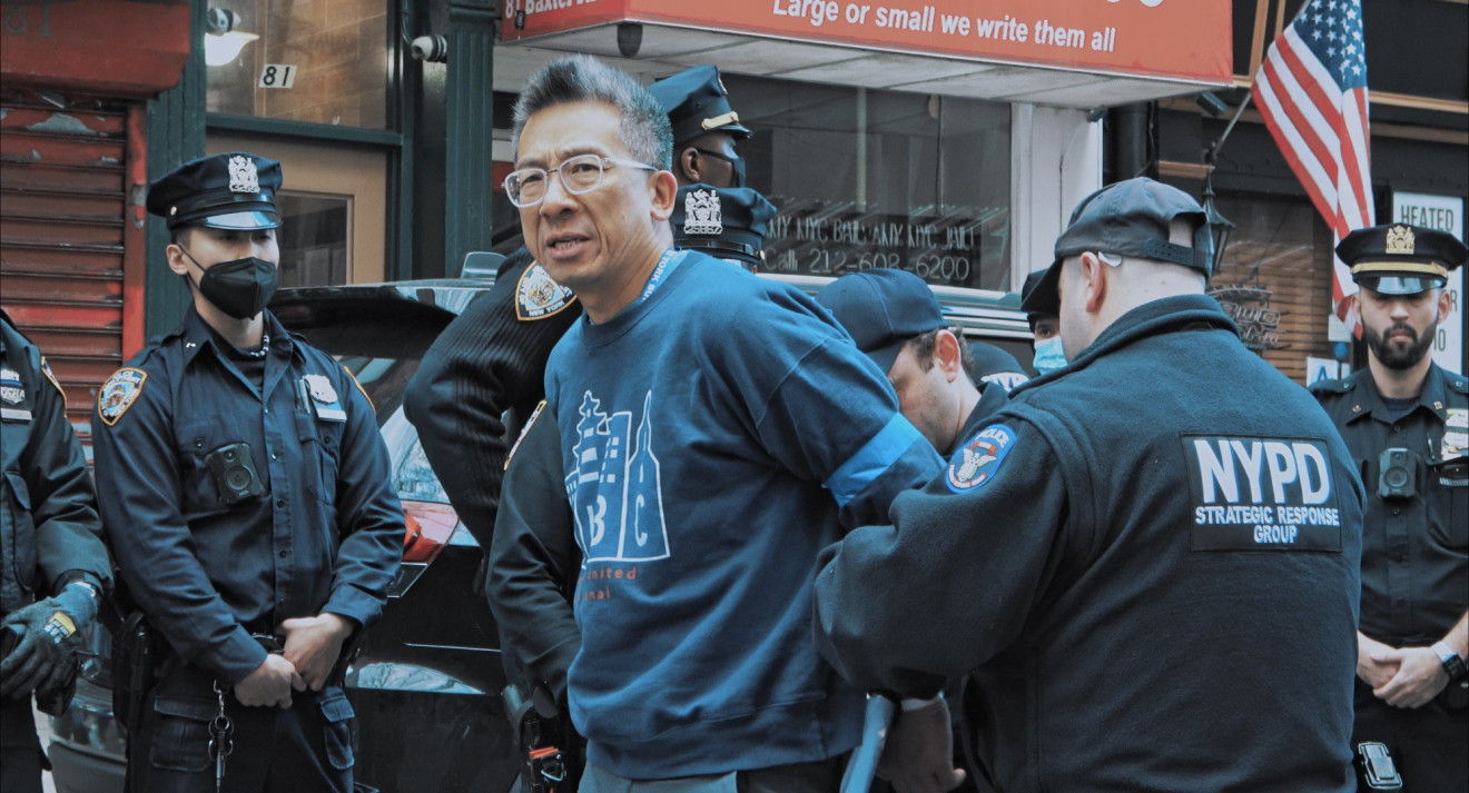 A man getting arrested by the NYDP on the streets of New York. 