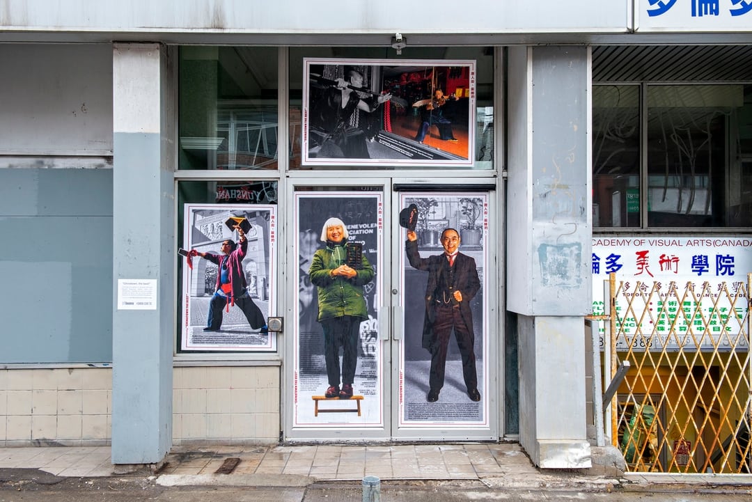 The entrance to a building in Toronto Chinatown is pasted with portraits of prominent elders from the community. 