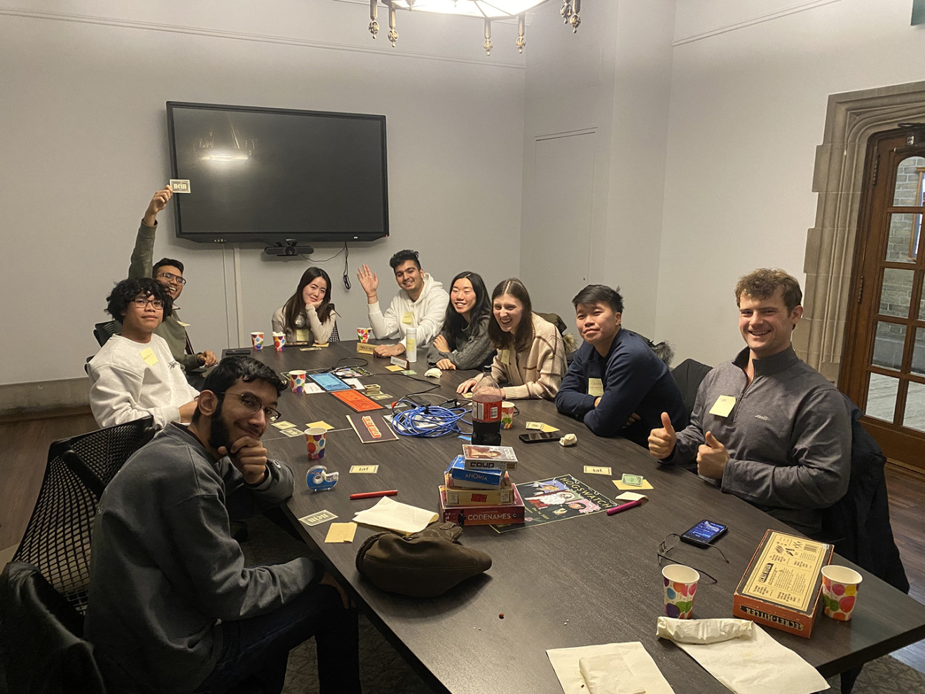 A group of university students playing board games.